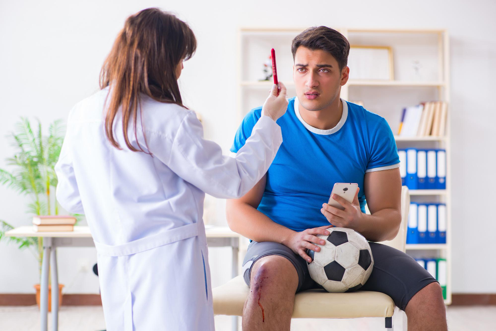 jugador futbol visitando al medico despues lesion
